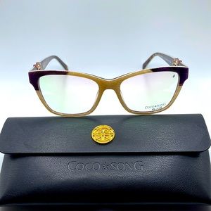 NWOT. Coco Song feather and silk collection. Purple, turquoise, and sand frames.